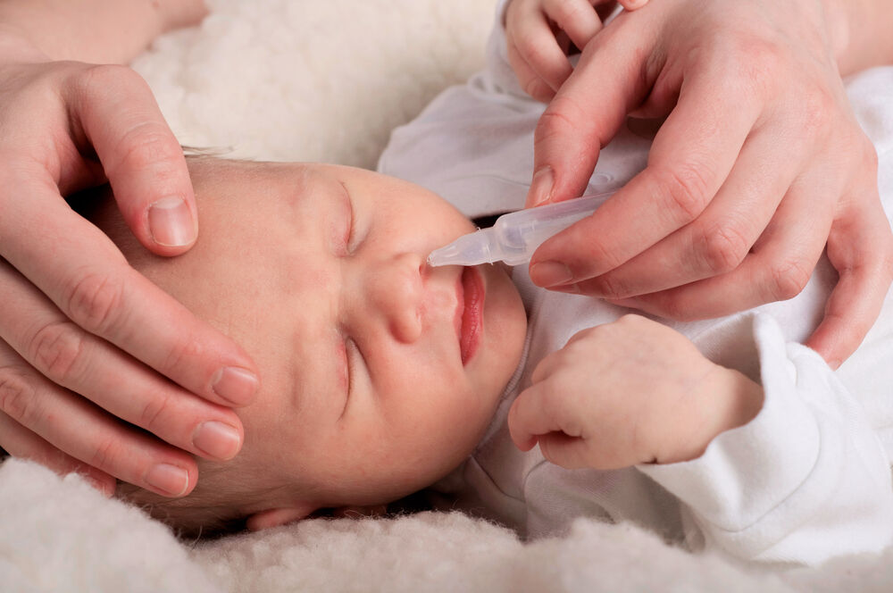 Newborn with stuffy nose and deals sneezing